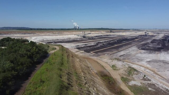 Hambach opencast lignite mine in the Rhenish lignite mining area near D&uuml;ren in Germany with Weisweiler Powerplant in the background