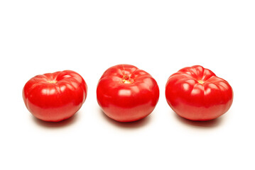 Red fresh tomato isolated on white background.