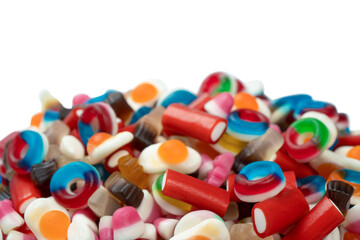 Tasty mix of jelly colorful candies isolated on a white background.