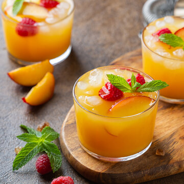 Summer refreshing drink, beverage, cocktail with peach and raspberry