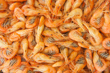 Cooked shrimps food background, top view