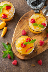 Summer refreshing drink, beverage, cocktail with peach and raspberry
