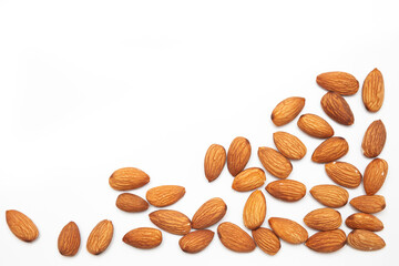 Close-up of natural big raw peeled almonds nuts as a background