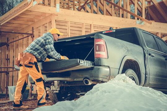 Constructor Preparing the Cargo Bed of His Pickup Truck for the Load