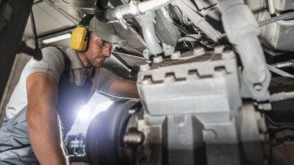 Industry Mechanic Performing Diesel Pusher Maintenance