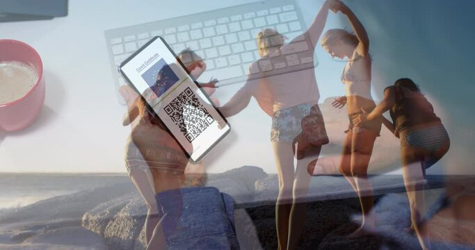 Animation of diverse friends at beach over caucasian woman with smartphone