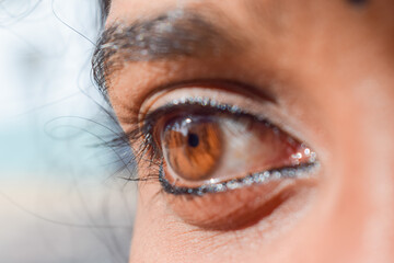 Close up image of brown eyes of a woman