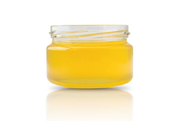 a small jar filled with fresh honey