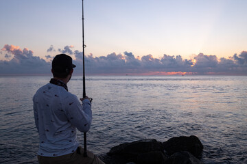 Fisherman looks out at ocean