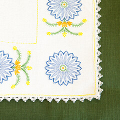 Detail of embroidery on a tablecloth.