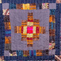 ornament of handcrafted crinkled patchwork scarf