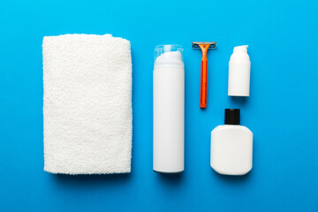 shaving man set. shaving machine, towel, lotion and shaving foam on colored background. Men bath Accessories top view