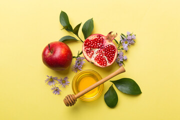 Flat lay composition with symbols jewish Rosh Hashanah holiday attributes on colored background, Rosh hashanah concept. New Year holiday Traditional. Top view with copy space