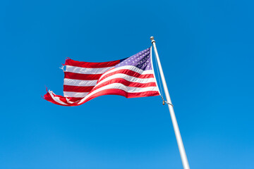 flag of united states of america on blue sky background