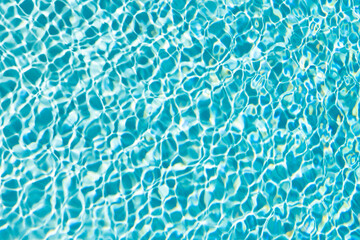 rippled water blue color in summertime swimming pool