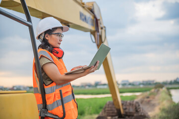 Environmental engineers work at the water storage plant, check the pH of the water, check the...