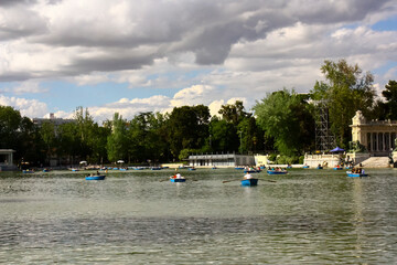 Close view of row boats in the pond in the Retiro park  during a sunny day in Madrid, Spain