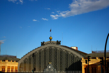 Close view of main entrance of Atocha railway station silhouetted against the blue sky in Madrid, Spain