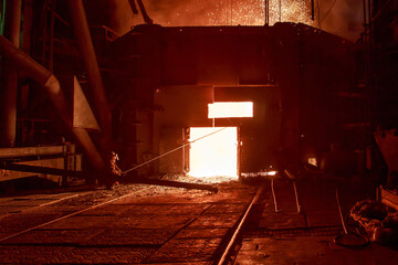 Tap hole of blast furnace at steel mill.