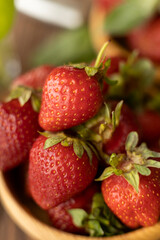 Strawberries in wood plate. Summer life. 