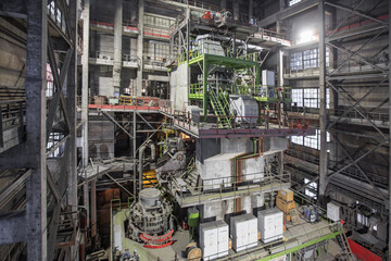 Crushing machine in iron foundry workshop.