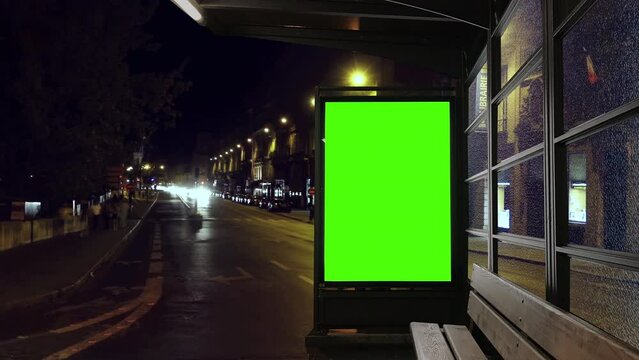Green Screen Billboard Bus Station Time Lapse Cars at Night. Digital panel green screen in the street at night. Time lapse of the cars traffic