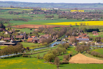 Naklejka premium Chateauneuf, France, April 17, 2022. Aerial view of Chateauneuf en Auxois and Vandenesse canal