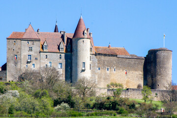 Fototapeta na wymiar Chateauneuf, France, April 17, 2022. the Chateau de Chateauneuf-en-Auxois is a fortress, typical of 15th century Burgundian military architecture