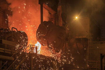 Casting ladle in steel mill workshop.