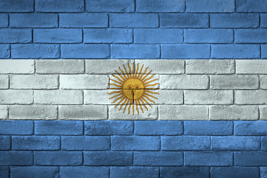Fototapeta Argentina flag painted on a brick wall. Flaga Argentyny namalowana na ścianie z cegły.