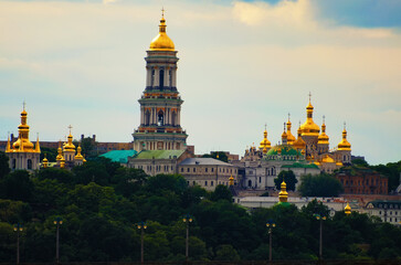 Panoramic landscape view of ancient Kyiv Pechersk Lavra. Sky with white clouds in the background. Christian Orthodox monastery. UNESCO World Heritage Site