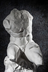 Gypsum copy of Belvedere Torso statue for artists. Replica of famous ancient Greek fragmentary marble sculpture of a male nude from Vatican Museums. Template design for art, dj, fashion, poster, zine. - obrazy, fototapety, plakaty