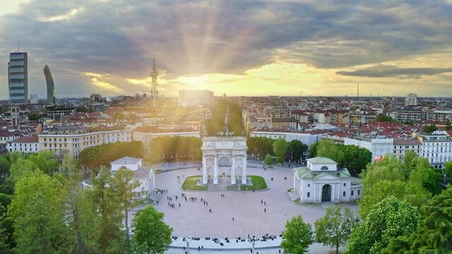 Italian city Milano in south region Lombardia aerial view from drone majestic Arco della pace central historical arch baroque architectural complex sightseeing in round square location with tourists