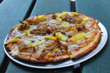 Pizza with pineapple and chicken