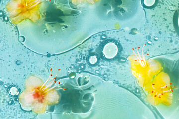 Chestnut flowers in drops of oil in light blue water