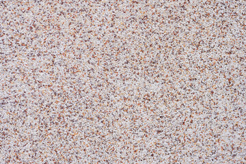 background of concrete chips in pastel pink color