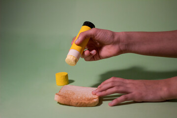 person holding butter stick