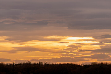 Cloudscape of beautiful sunset on a cloudy day during golden hour