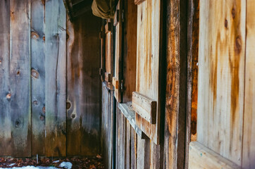 The windows and door of an old wooden cabin