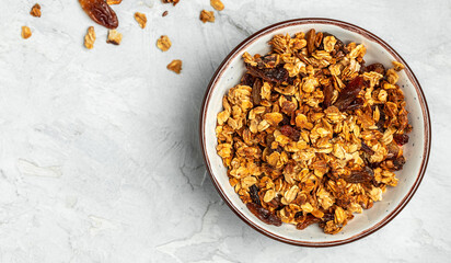 Bowl with granola on a light background. superfood concept. Healthy, clean eating. Vegan or gluten free diet. Long banner format. top view