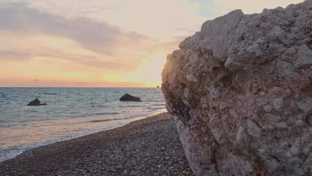 Beautiful sunset view of the beach around Petra tou Romiou, in Paphos, Cyprus. It is considered to be Aphrodite's birthplace in Greek mythology.
