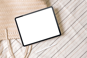Summer boho lifestyle mockup of new version tablet in trendy thin frame design with white screen on...