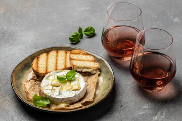 camembert cheese baked with with basil leaves and wine. banner, menu, recipe place for text, top...