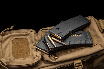 Cartridges and clips for a rifle or carbine. Ammunition for weapons. Ammunition for weapons lies on...