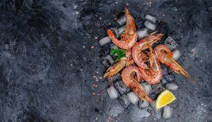 Seafood. Red Argentine shrimps with salt and lemon, Wild shrimps, ocean jumbo shrimps on a dark background. banner, menu, recipe place for text, top view