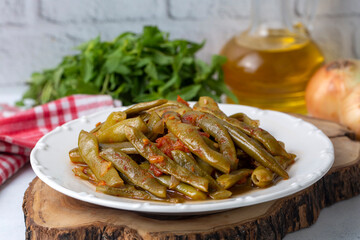 Traditional delicious Turkish food; Green beans with olive oil; Turkish name; Zeytinyagli taze fasulye