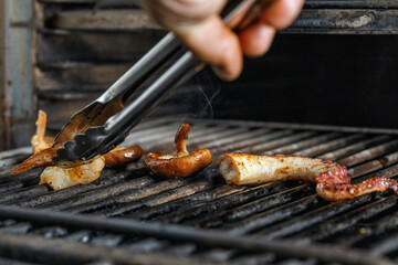 Process of grilling seafood on a barbecue grill over hot coal. Seafood recipes