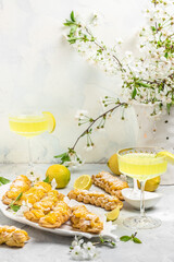 Limoncello. Traditional italian homemade alcoholic drink in glass with pieces of lemon, sweet Italian lemon liqueur. vertical image. top view. place for text