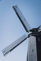 windmill with blue sky in the background