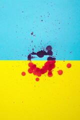stock photo of heart on ukraine flag with blood drops on it. war concept